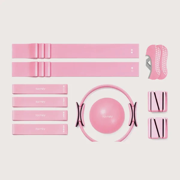 Toning kit pieces laid out flat: bands, ring, ball, ankle weights and grip socks